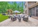 Paver stone patio with outdoor seating offering an inviting and relaxing outdoor space at 1056 James Madison Dr, Matthews, NC 28104
