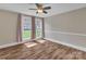 Bright bedroom with hardwood flooring and a large window offering a view of the outdoors at 111 E Church St, Stanley, NC 28164