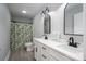 Bright, updated bathroom with double vanity, framed mirrors, modern fixtures, and stylish shower curtain at 1138 Zeb Haynes Rd, Maiden, NC 28650