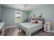 Bright bedroom with natural light from the window and grey wood laminate flooring at 1138 Zeb Haynes Rd, Maiden, NC 28650