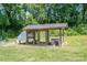 Backyard chicken coop in the green, grassy yard at 1138 Zeb Haynes Rd, Maiden, NC 28650