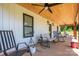 Cozy covered porch featuring ample seating and stylish lighting, perfect for enjoying the outdoors at 1138 Zeb Haynes Rd, Maiden, NC 28650