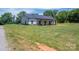 Spacious front yard with a view of a charming single-story home and well-maintained landscaping at 1138 Zeb Haynes Rd, Maiden, NC 28650