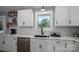 Updated kitchen with sleek appliances, white cabinetry, and elegant marble countertops offering a modern cooking space at 1138 Zeb Haynes Rd, Maiden, NC 28650