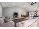 Open concept living room and dining area with vaulted ceilings, gray paint, and plank flooring at 1138 Zeb Haynes Rd, Maiden, NC 28650