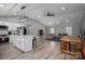 Open-concept kitchen and living area with modern lighting, flooring, and neutral wall tones at 1138 Zeb Haynes Rd, Maiden, NC 28650