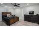 Bedroom featuring a wooden bed frame, black bedding, a ceiling fan and natural light from two windows at 1138 Zeb Haynes Rd, Maiden, NC 28650