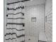 Tiled shower with subway tile, hexagon tile floor, a built-in niche, and a black shower curtain at 1138 Zeb Haynes Rd, Maiden, NC 28650