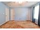 Spacious carpeted bedroom offers natural light, ceiling fan, and ample closet space at 1170 Scenic Dr, Shelby, NC 28150