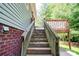 Exterior view of stairs to backyard deck overlooking the landscaped yard at 1170 Scenic Dr, Shelby, NC 28150