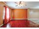 Spacious living room featuring rich hardwood floors, neutral paint, and a ceiling fan at 1170 Scenic Dr, Shelby, NC 28150