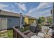 The wooden deck features outdoor seating and a grill, perfect for enjoying the sunny backyard at 12531 Bryton Ridge Pkwy, Huntersville, NC 28078