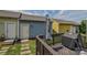 A backyard view with a quaint wooden deck features seating and a grill, perfect for outdoor living at 12531 Bryton Ridge Pkwy, Huntersville, NC 28078
