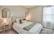 Cozy bedroom offering a neutral color palette, natural light, and a calming ambiance at 12531 Bryton Ridge Pkwy, Huntersville, NC 28078