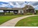 Stunning clubhouse featuring stone accents and a welcoming walkway for community enjoyment at 12531 Bryton Ridge Pkwy, Huntersville, NC 28078