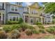 Charming townhome with stone accents, colorful siding, manicured lawn, and inviting front entrance at 12531 Bryton Ridge Pkwy, Huntersville, NC 28078