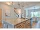 Bright open concept kitchen features stainless appliances, granite island, and easy access to dining room at 12531 Bryton Ridge Pkwy, Huntersville, NC 28078
