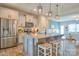 Well-lit kitchen with granite island, stainless appliances, and easy access to dining and living spaces at 12531 Bryton Ridge Pkwy, Huntersville, NC 28078