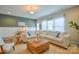 Cozy living room features comfortable seating, stylish decor, and plenty of natural light at 12531 Bryton Ridge Pkwy, Huntersville, NC 28078