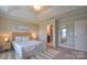 A serene main bedroom features a tray ceiling, and en-suite bathroom, perfect for relaxing at 12531 Bryton Ridge Pkwy, Huntersville, NC 28078