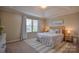 Relaxing main bedroom with large windows, tray ceiling, and coastal decor at 12531 Bryton Ridge Pkwy, Huntersville, NC 28078
