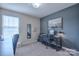 Office space with neutral gray tones, natural light, and a dedicated workspace at 12531 Bryton Ridge Pkwy, Huntersville, NC 28078