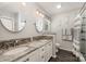 Bathroom with granite countertops, double sinks, decorative backsplash, and gray wood floors at 130 Greenwich Dr, Statesville, NC 28677