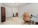 Bright bedroom featuring neutral carpet, office space, and a traditional rocking chair at 130 Greenwich Dr, Statesville, NC 28677