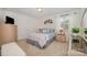 Cozy bedroom with carpet, dresser, TV, window, and butterfly wall decor at 130 Greenwich Dr, Statesville, NC 28677
