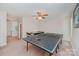 Bonus room with ping pong table, air hockey table, ceiling fan, and neutral carpet at 130 Greenwich Dr, Statesville, NC 28677