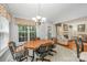 Bright breakfast nook with a view into the living room with a fireplace at 130 Greenwich Dr, Statesville, NC 28677