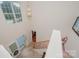 Bright foyer with large window above the entry, tiled floor, and staircase with carpet at 130 Greenwich Dr, Statesville, NC 28677