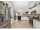 Spacious kitchen featuring stainless steel appliances, tile flooring, and plenty of counter space at 130 Greenwich Dr, Statesville, NC 28677