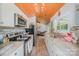 Modern kitchen features stainless steel appliances, granite countertops, and stylish backsplash, with seamless access to the living area at 130 Greenwich Dr, Statesville, NC 28677