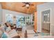 Open-concept living area features a cozy seating area and easy access to a bathroom and outdoor spaces at 130 Greenwich Dr, Statesville, NC 28677