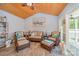 Cozy living room with vaulted wood ceiling, comfortable seating, and tranquil views of the outdoors at 130 Greenwich Dr, Statesville, NC 28677