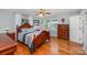Spacious bedroom featuring hardwood floors, ceiling fan, and windows allowing for natural light at 130 Greenwich Dr, Statesville, NC 28677