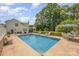 Spacious backyard pool with ample seating and lush landscaping, ideal for entertaining guests at 130 Greenwich Dr, Statesville, NC 28677
