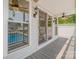 Covered patio featuring view of the pool, ceiling fans, and tile flooring at 130 Greenwich Dr, Statesville, NC 28677