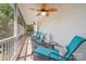 Inviting screened porch featuring comfortable lounge chairs and a ceiling fan for relaxation at 130 Greenwich Dr, Statesville, NC 28677