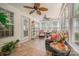 Inviting sunroom featuring comfortable seating, ceiling fans, and abundant natural light at 130 Greenwich Dr, Statesville, NC 28677