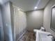 Bathroom featuring neutral walls, tile floors, and a shower with checkered curtain at 1327 Wiscassett St, Albemarle, NC 28001