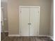 A bright bedroom features laminate flooring, neutral walls, and a closet at 1327 Wiscassett St, Albemarle, NC 28001