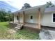 Inviting covered front porch with wood columns and plenty of space for relaxing at 1327 Wiscassett St, Albemarle, NC 28001
