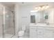 Bright bathroom with a glass enclosed shower, white vanity, and a large mirror at 138 Lanyard Dr # B, Mooresville, NC 28117