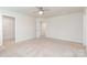 Bright bedroom with plush carpeting, a ceiling fan, and a walk-in closet for ample storage at 138 Lanyard Dr # B, Mooresville, NC 28117