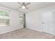 Bedroom featuring carpeted floors, two windows, and a ceiling fan at 138 Lanyard Dr # B, Mooresville, NC 28117
