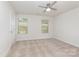 Bedroom with neutral carpet, bright white walls, and a ceiling fan at 138 Lanyard Dr # B, Mooresville, NC 28117