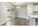 Dining area with modern flooring, sliding glass doors leading to the backyard, and contemporary lighting at 138 Lanyard Dr # B, Mooresville, NC 28117