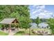 Lakeside gazebo with stone columns and outdoor furniture on a paved patio at 138 Lanyard Dr # B, Mooresville, NC 28117